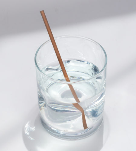 6-inch Skinny Sipper hemp straw in a glass of water